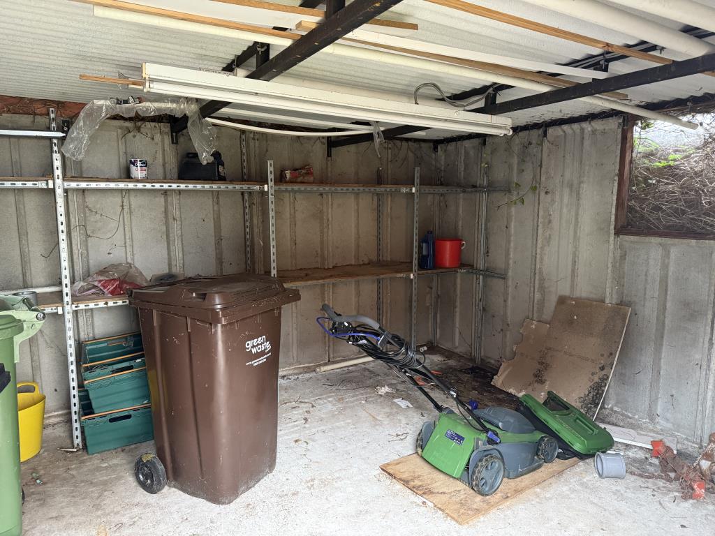 Lot: 128 - TWO-BEDROOM FLAT WITH GARAGE IN NEED OF IMPROVEMENT - Inside view of garage